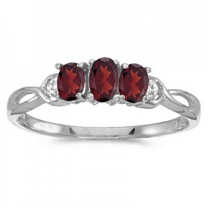 10k White Gold Oval Garnet And Diamond Three Stone Ring